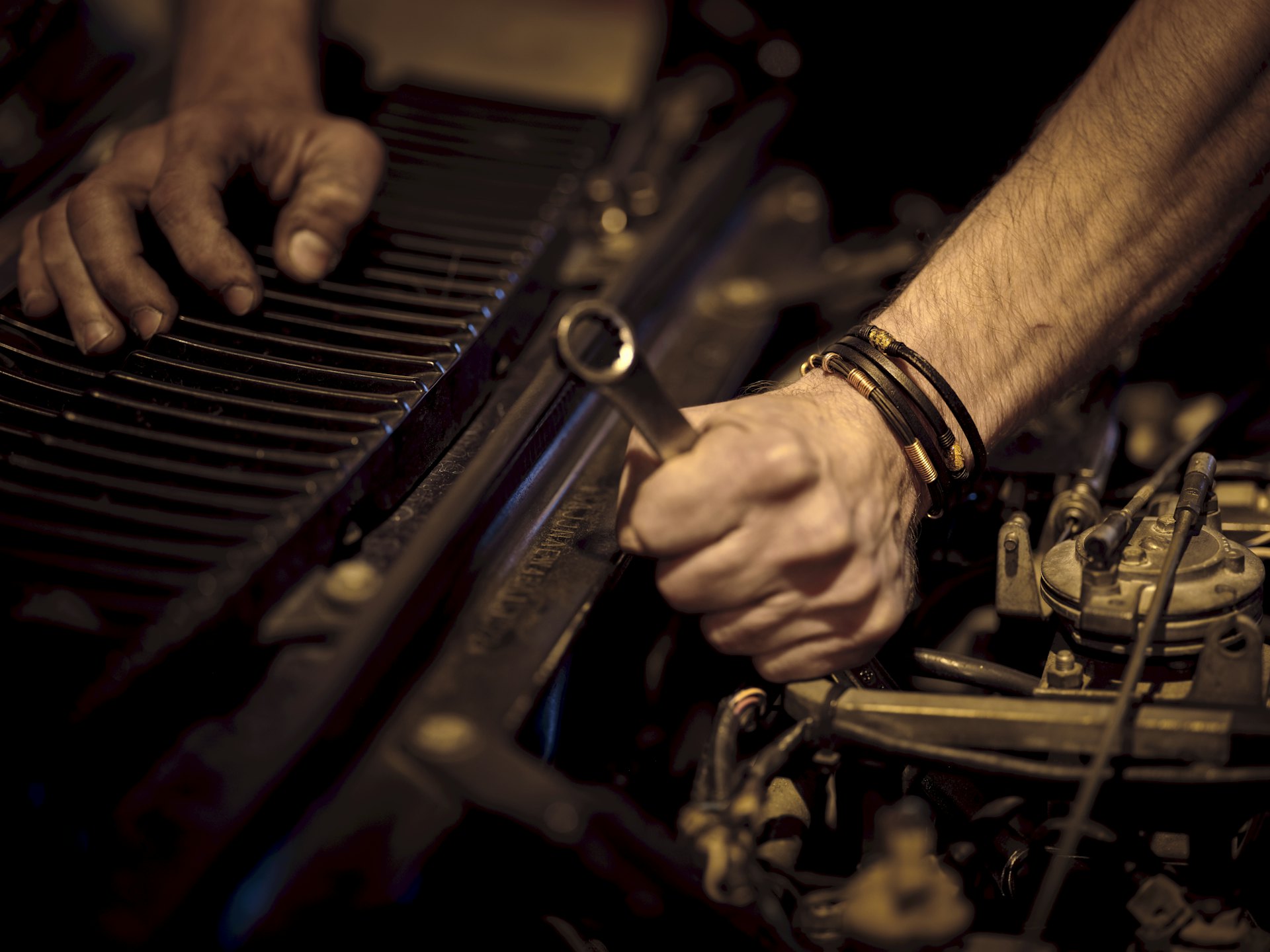 ALL Motors technician at work on an engine